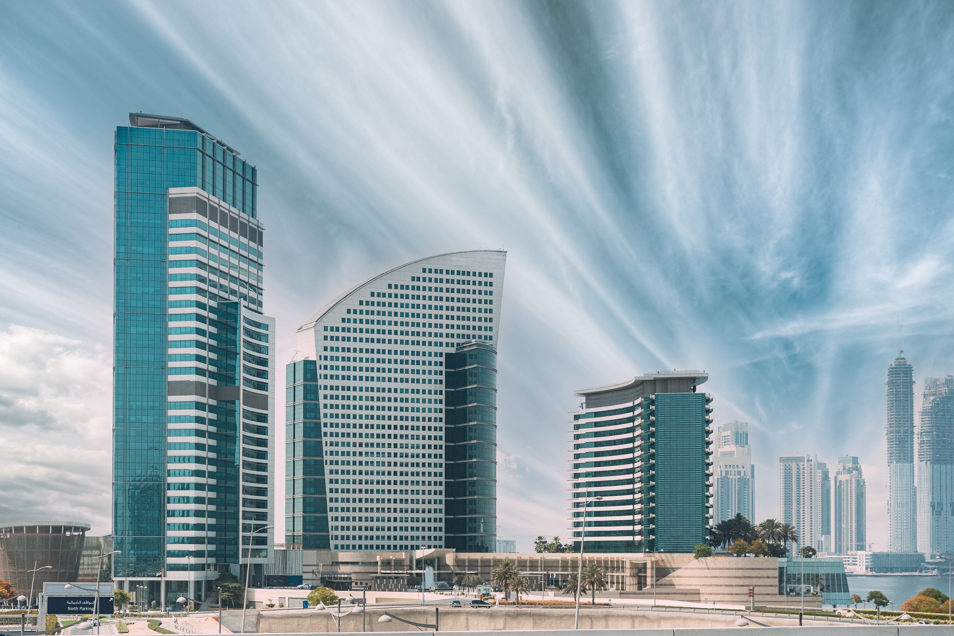 Hotel InterContinental Dubai Marina, an IHG Hotel and Crowne Plaza hotel. View of high-rise buildings of residential district in Dubai Marina in sunny day. Urban background